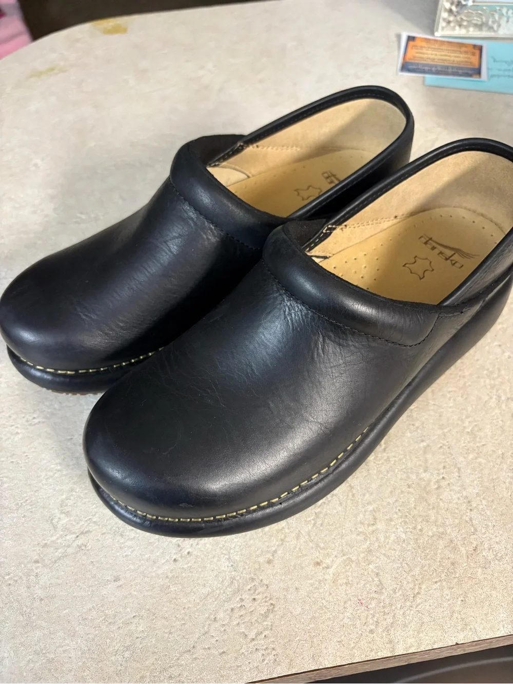 Dansko Black Leather Slip-On Clog with Yellow Stitching